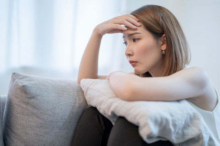 Asian women with stress, She kept herself alone in her bedroom, Depression.