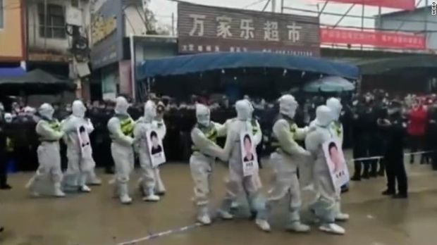 Chinese police parade people-smuggling suspects in Jingxi city, Guangxi province on Tuesday. (Weibo via CNN)