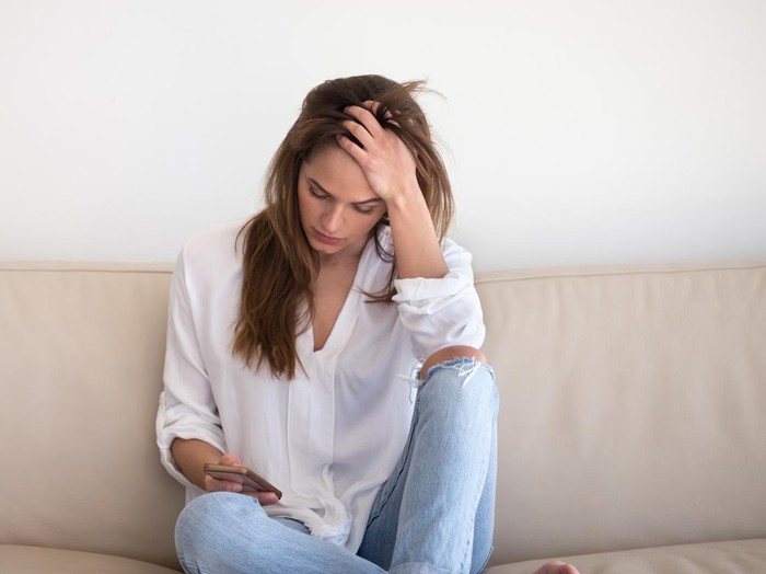 1192627554 Emotional angry woman screams and torn rip into two pieces photography where shown picture together with ex-husband or boyfriend, concept of adultery, divorce, break up, end of relationship, jealousy