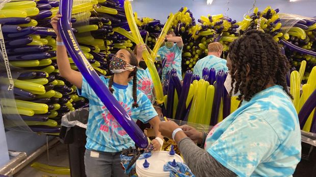 Aimie Sarkodie-Mensah-Best left, and Jaki Jackson, right,, inflate balloons, on Thursday, Dec. 30, 2021, in New York, that are part of the Times Square New Year's Eve celebration to welcome the year 2022. (AP Photo/Ted Shaffrey)