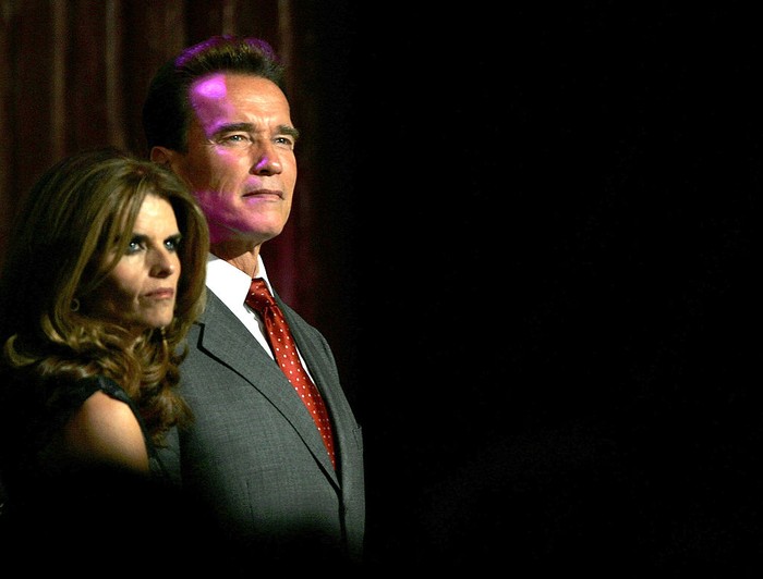 BEIJING - NOVEMBER 16:  California Governor Arnold Schwarzenegger and his wife Maria Shriver watch models at a reception held to promote California on November 16, 2005 in Beijing, China. Schwarzenegger is in China for a six-day visit aimed at boosting trade, investment and at battling movie piracy.  (Photo by Cancan Chu/Getty Images)