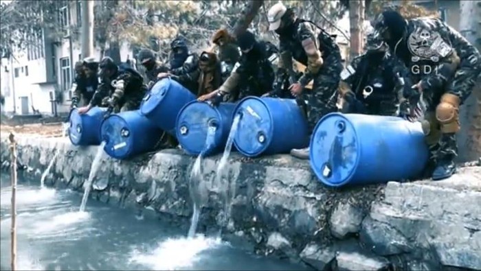 A screengrab of a video released by the General Directorate of Intelligence (GDI) showing its agents pouring alcohol into a canal. (Photo: Twitter/General Directorate of Intelligence)