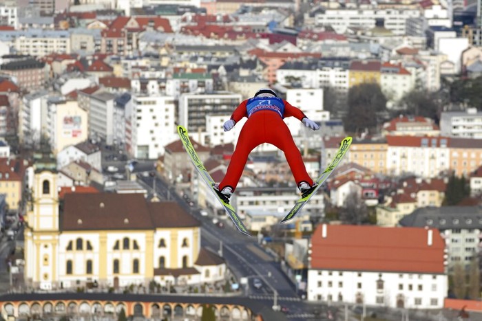 Philipp Aschenwald of Austria soars through the air during his second trial jump at the third stage of the 70th Four Hills ski jumping tournament in Innsbruck, Austria, Monday, Jan. 3, 2022. (AP Photo/Matthias Schrader)