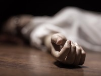 The dead womans body. Focus on hand