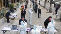 Lonjakan kasus COVID-19 di kawasan Xian membuat China mengunci dan membatasi aktivitas warga di area tersebut sejak beberapa pekan lalu. Tao Ming/Xinhua via AP.