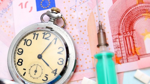 compass and fifty euro banknotes background business and finance concepts