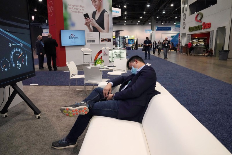 Attendees make their way through the Central Hall of the Las Vegas Convention Center prior to the CES tech show Tuesday, Jan. 4, 2022, in Las Vegas. The show runs from January 5-7. (AP Photo/Joe Buglewicz)