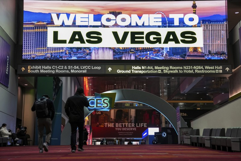 Attendees make their way through the Central Hall of the Las Vegas Convention Center prior to the CES tech show Tuesday, Jan. 4, 2022, in Las Vegas. The show runs from January 5-7. (AP Photo/Joe Buglewicz)