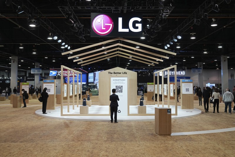 Attendees make their way through the Central Hall of the Las Vegas Convention Center prior to the CES tech show Tuesday, Jan. 4, 2022, in Las Vegas. The show runs from January 5-7. (AP Photo/Joe Buglewicz)