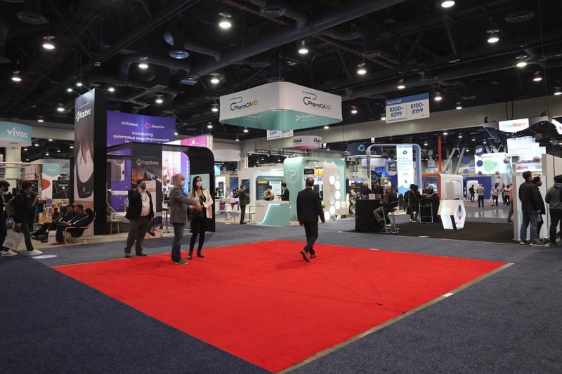 Attendees make their way through the Central Hall of the Las Vegas Convention Center prior to the CES tech show Tuesday, Jan. 4, 2022, in Las Vegas. The show runs from January 5-7. (AP Photo/Joe Buglewicz)