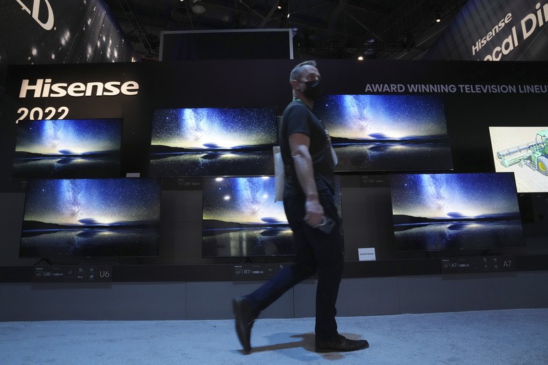 Attendees make their way through the Central Hall of the Las Vegas Convention Center prior to the CES tech show Tuesday, Jan. 4, 2022, in Las Vegas. The show runs from January 5-7. (AP Photo/Joe Buglewicz)