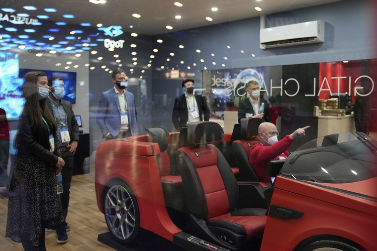 Gadget Show Attendees make their way through the Central Hall of the Las Vegas Convention Center prior to the CES tech show Tuesday, Jan. 4, 2022, in Las Vegas. The show runs from January 5-7. (AP Photo/Joe Buglewicz)