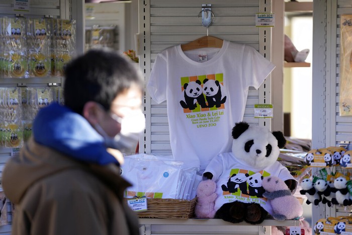 Japan Panda Souvenir products of the twin giant pandas Xiao Xiao and Lei Lei are sold at a shop Wednesday, Jan. 12, 2022, at Ueno Zoo. in Tokyo. Twin panda cubs made their long-awaited first public appearance Wednesday before their devoted fans but only limited to three days as their zoo has to close amid the upsurge of the highly transmissible coronavirus variant. (AP Photo/Eugene Hoshiko)
