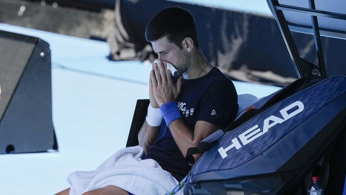 Defending mens champion Serbias Novak Djokovic rests during a practice session on Rod Laver Arena ahead of the Australian Open tennis championship in Melbourne, Australia, Wednesday, Jan. 12, 2022. AP Photo/Mark Baker)