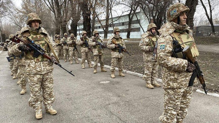 In this photo released by the Russian Defense Ministry Press Service, Russian peacekeepers of the Collective Security Treaty Organization park their military vehicles to guard an area in Almaty, Kazakhstan, Tuesday, Jan. 11, 2022. The president of Kazakhstan has announced that a Russia-led security alliance will start pulling out its troops from the Central Asian country in two days after completing its mission. The mostly Russian troops were deployed to Kazakhstan last week by the Collective Security Treaty Organization, an alliance of six former Soviet states, at the presidents request amid unprecedented public unrest. (Russian Defense Ministry Press Service via AP)