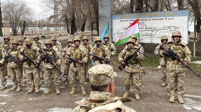 In this photo released by the Russian Defense Ministry Press Service, Russian peacekeepers of the Collective Security Treaty Organization park their military vehicles to guard an area in Almaty, Kazakhstan, Tuesday, Jan. 11, 2022. The president of Kazakhstan has announced that a Russia-led security alliance will start pulling out its troops from the Central Asian country in two days after completing its mission. The mostly Russian troops were deployed to Kazakhstan last week by the Collective Security Treaty Organization, an alliance of six former Soviet states, at the president's request amid unprecedented public unrest. (Russian Defense Ministry Press Service via AP)