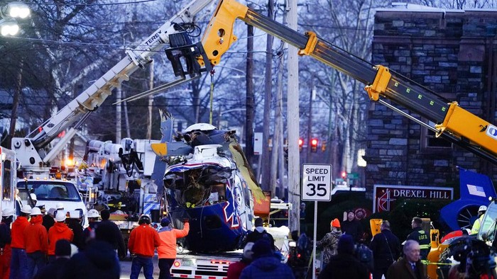 A medical helicopter rests next to the Drexel Hill United Methodist Church after it crashed in the Drexel Hill section of Upper Darby, Pa., on Tuesday, Jan. 11, 2022. (AP Photo/Matt Rourke)