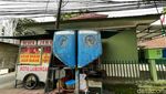 Upsss! Bekas Telepon Umum Ini Disulap PKL Jadi Tempat Masak