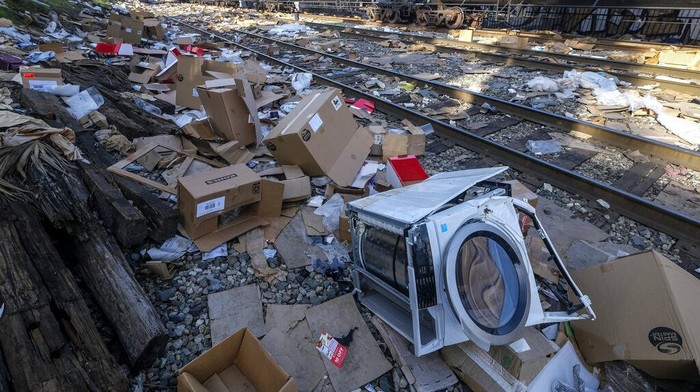 Shredded boxes and packages are seen at a section of the Union Pacific train tracks in downtown Los Angeles Friday, Jan. 14, 2022. Thieves have been raiding cargo containers aboard trains nearing downtown Los Angeles for months, leaving the tracks blanketed with discarded packages. The sea of debris left behind included items that the thieves apparently didn't think were valuable enough to take, CBSLA reported Thursday. (AP Photo/Ringo H.W. Chiu)