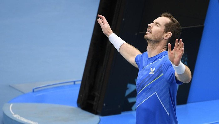 Andy Murray of Britain reacts after defeating Nikoloz Basilashvili of Georgia in their first round match at the Australian Open tennis championships in Melbourne, Australia, Tuesday, Jan. 18, 2022. (AP Photo/Andy Brownbill)