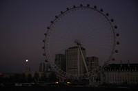 The first full moon of the year known as a Wolf Moon is seen behind different clock faces showing different times, with the correct time at right, as refurbishment work continues on the Elizabeth Tower, known as Big Ben, and the Houses of Parliament, in London, Monday, Jan. 17, 2022. (AP Photo/Matt Dunham)