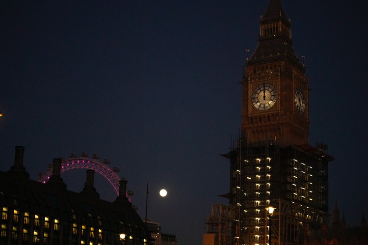 Britain Moon The first full moon of the year known as a Wolf Moon is seen behind different clock faces showing different times, with the correct time at right, as refurbishment work continues on the Elizabeth Tower, known as Big Ben, and the Houses of Parliament, in London, Monday, Jan. 17, 2022. (AP Photo/Matt Dunham)