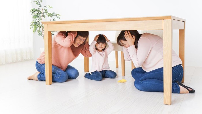 Family taking shelter under the desk