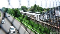 Dari akses keluar-masuk di permukiman Bintaro, penumpang KRL menyeberang lewat jembatan yang membentang di atas Tol JORR.