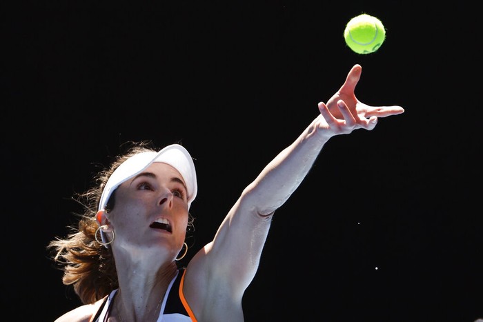 Australian Open Tennis Alize Cornet of France serves to Garbine Muguruza of Spain during their second round match at the Australian Open tennis championships in Melbourne, Australia, Thursday, Jan. 20, 2022. (AP Photo/Hamish Blair)