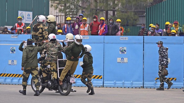 Indo Tibetan Border Security force soldiers display their skill on moving motorcycles during rehearsals for the upcoming Republic Day parade at Raisina hills, the government seat of power, in New Delhi, India, Thursday, Jan. 20, 2022. India celebrates Republic Day on Jan. 26, highlighted by a parade by different branches of the military as well as a display of arms and missiles. (AP Photo/Manish Swarup)