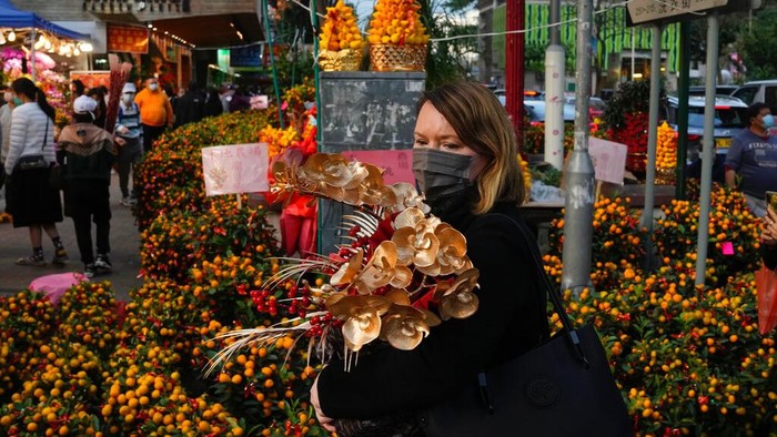 Pots of orchids are displayed for sale to celebrate the Lunar New Year in Hong Kong, Wednesday, Jan. 19, 2022. The Chinese Lunar New Year falls on Feb. 1, 2022. (AP Photo/Kin Cheung)