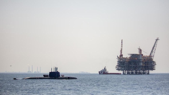 FILE - An oil platform in Israels offshore Leviathan gas field is seen from on board the Israeli Navy Ship Atzmaut as a submarine patrols in the Mediterranean Sea , Sept. 1, 2021. Israel signed a three billion euro ($3.4 billion) deal on Thursday, Jan. 20, 2022, to buy three cutting edge submarines from Germany, the defense ministry announced. The Dakar-class diesel-electric submarines will be produced by German manufacturer Thyssenkrupp and are expected to be delivered within nine years, the ministry said. (AP Photo/Ariel Schalit, File)