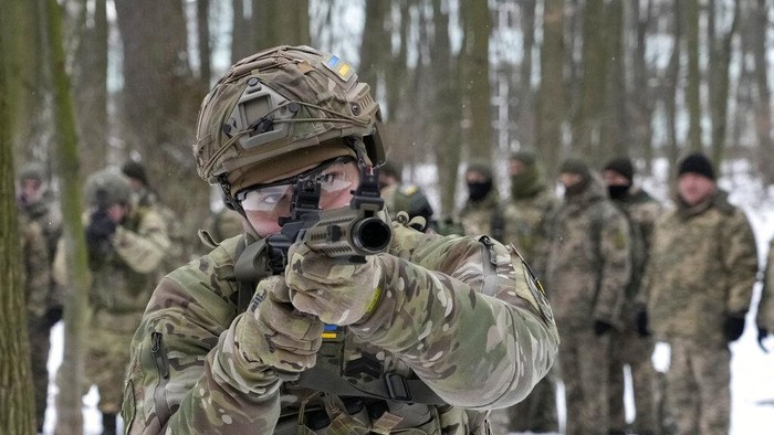 Members of Ukraines Territorial Defense Forces, volunteer military units of the Armed Forces, train in a city park in Kyiv, Ukraine, Saturday, Jan. 22, 2022. Dozens of civilians have been joining Ukraines army reserves in recent weeks amid fears about Russian invasion. (AP Photo/Efrem Lukatsky)