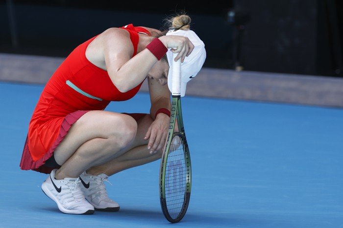 Simona Halep of Romania rests between points against Alize Cornet of France during their fourth round match at the Australian Open tennis championships in Melbourne, Australia, Monday, Jan. 24, 2022. (AP Photo/Tertius Pickard)