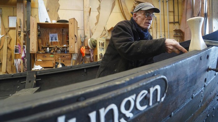An 11th century, 14-meter Viking coastal trading vessel, sits on display at the Viking Ship Museum. Roskilde, Denmark, Monday, Jan. 17, 2022. For thousands of years, wooden sail boats, best known for having been in use during the Viking-era, allowed the peoples of northern Europe to spread trade, influence and -- in some cases war — across the seas and rivers. In December, UNESCO, the U.N.’s culture agency, added the “clinker’ boat traditions to its list of “Intangible Cultural Heritage,” the result of the first joint nomination from the whole Nordic region. (AP Photo/James Brooks)