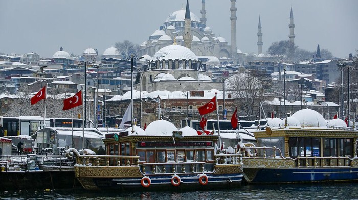 People throw snowballs each other on the snow-covered park in Istanbul, Turkey, on Monday, Jan. 24, 2022. A severe snowstorm disrupted road and air traffic Monday in the Greek capital of Athens and in neighboring Turkeys largest city of Istanbul, while snow blanketed most of Turkey and Greece, including several Aegean islands. (AP Photo/Emrah Gurel)