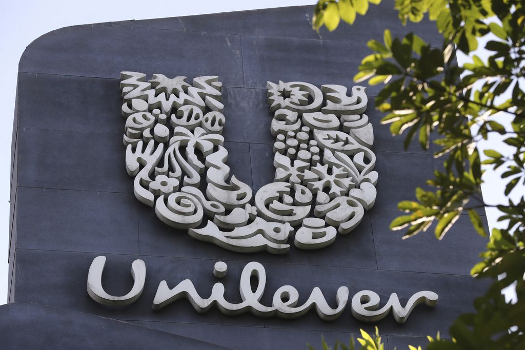 FILE - A view of a Unilever logo, displayed outside the head office of PT Unilever Indonesia Tbk. in Tangerang, Indonesia, Tuesday, Nov. 16, 2021. Unilever, which makes Vaseline skin care products and Ben & Jerry’s ice cream, says it's laying off 1,500 staff as part of a company-wide restructuring. The proposed changes mean that senior management jobs will be cut by about 15% while junior management roles will be reduced by 5%, it said Tuesday Jan. 25, 2022. The London-based consumer goods giant employs 149,000 people globally.  (AP Photo/Tatan Syuflana, FIle)