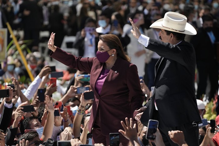 President-elect Xiomara Castro arrives with her husband, former President Manuel Zelaya who was ousted by a military coup, for Castro's inauguration as the first female president in Tegucigalpa, Honduras, Thursday, Jan. 27, 2022. (AP Photo/Moises Castillo)