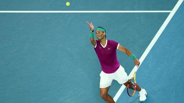 MELBOURNE, AUSTRALIA - JANUARY 28: Rafael Nadal of Spain serves in his Mens Singles semi-final match against Matteo Berrettini of Italy during day 12 of the 2022 Australian Open at Melbourne Park on January 28, 2022 in Melbourne, Australia. (Photo by Clive Brunskill/Getty Images)