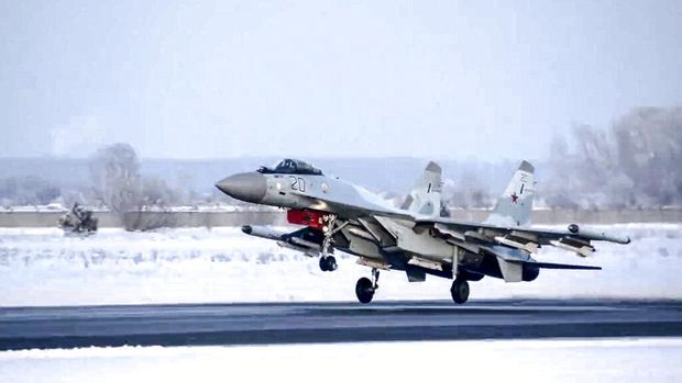 In this image taken from video provided by the Russian Defense Ministry Press Service, a pair of Tu-95 strategic bombers of the Russian air force are parked at an air base in Engels near the Volga River in Russia, Monday, Jan. 24, 2022. Russia has intensified military drills amid tensions with the West over the buildup of an estimated 100,000 Russian troops near Ukraine that fueled Western fears of an invasion. (Russian Defense Ministry Press Service via AP)