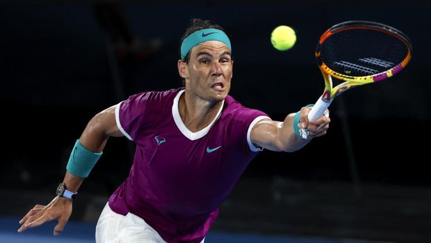 Rafael Nadal of Spain plays a forehand return to Daniil Medvedev of Russia during the men's singles final at the Australian Open tennis championships in Melbourne, Australia, Sunday, Jan. 30, 2022. (AP Photo/Hamish Blair)