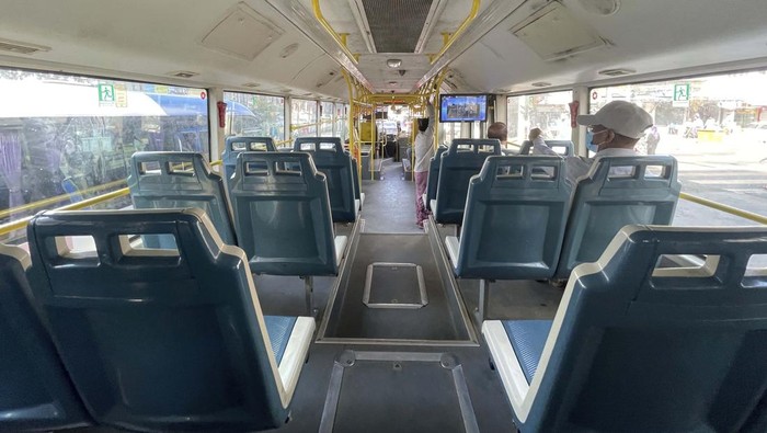 Few commuters ride on a mostly empty bus in Yangon, Myanmar on Tuesday, Feb. 1, 2022. Opponents of military rule in Myanmar on Tuesday marked the one-year anniversary of the army's seizure of power with a nationwide strike to show their strength and solidarity amid concern about what has become an increasingly violent contention for power. (AP Photo)