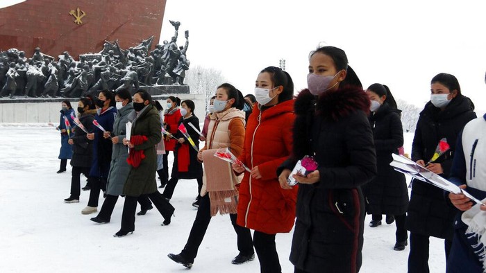People visit the statues of former North Korean leaders Kim Il Sung and Kim Jong Il on Mansu Hill in Pyongyang, North Korea, on the occasion of Lunar New Year holidays on Tuesday, Feb. 1, 2022. (AP Photo/Jon Chol Jin)