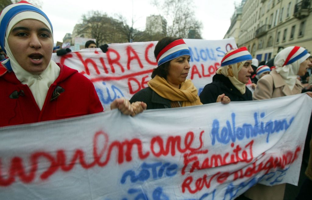 PARIS - JANUARY 17:  Muslim women demonstrate against the French proposal to bar Muslim women from wearing headscarves in state schools on January 17, 2004 in Paris, France. French President Jacques Chirac asked parliament to ban the wearing of 