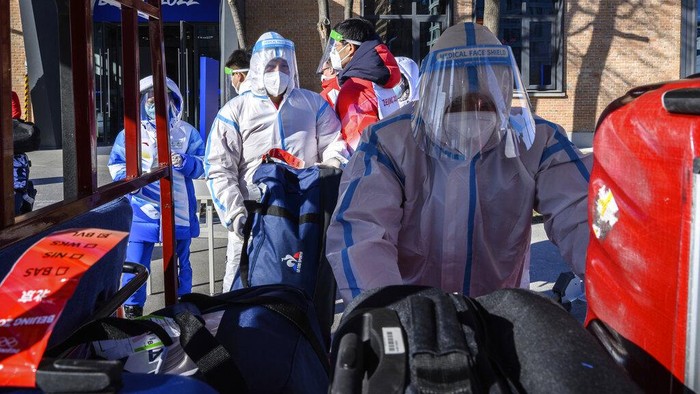 Members of Team France arrive at the Olympic Village ahead of the 2022 Winter Olympics, Tuesday, Feb. 1, 2022, in Beijing. (Anthony Wallace/Pool Photo via AP)
