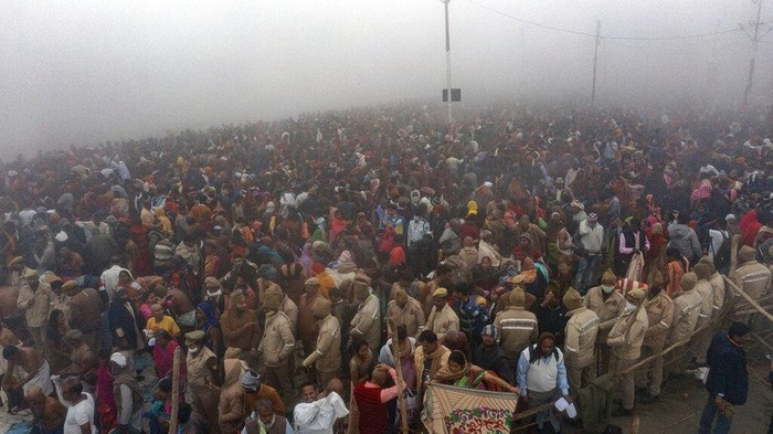 Indian Hindu devotees gather to take holy dips at Sangam, the confluence of the rivers Ganges and the Yamuna on 'Mauni Amavasya' or new moon day, third and the most auspicious date of bathing day during the annual month long Hindu religious fair 