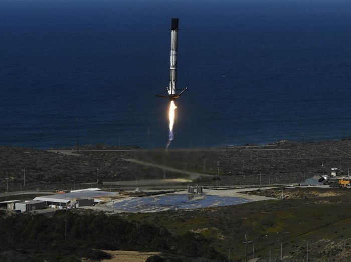 The reusable first stage of a SpaceX (Space Exploration Technologies Corp.) Falcon 9 rocket returns to land after the launch of the NROL-87 spy satellite payload for the National Reconnaissance Office from the SLC-4E launch pad at Vandenberg US Space Force Base on February 2, 2022 in Lompoc, California. (Photo by Patrick T. FALLON / AFP)