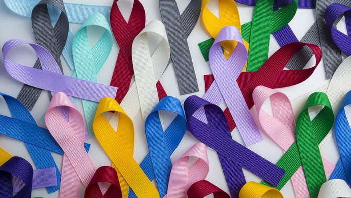 Colorful cancer ribbons as Health symbols for all types of cancers with copy area