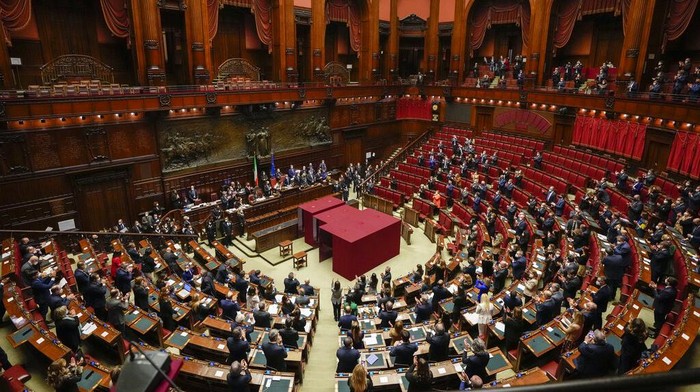 Lawmakers clap their hands after Sergio Mattarella is re-elected as Italy's 13th president in the Italian parliament in Rome, Saturday, Jan. 29, 2022, at the end of the eighth round of voting. (AP Photo/Gregorio Borgia, Pool)