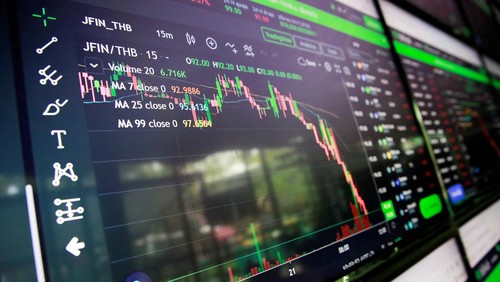 People pass their time at a cafe which has dozens of screens showing the latest trends and prices on various cryptocurrencies for their crypto investors customers in Nakhon Ratchasima, Thailand January 21, 2022. Picture taken January 21, 2022. REUTERS/Soe Zeya Tun